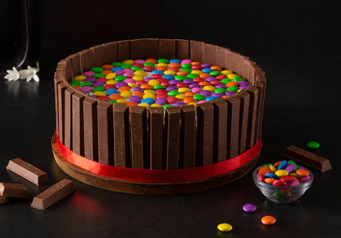 Kitkat gems chocolate cake Mille Crust Bakery, Trivandrum